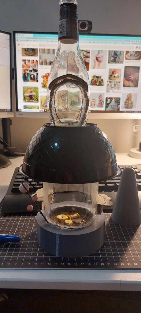 Beginning stages of the music box project, showing the bottle, bowl and jar put together, ready for clay application.