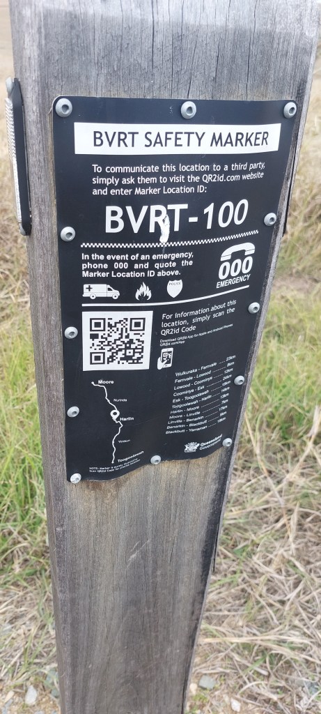 Shows the 100 kilometre marker for the rail trail